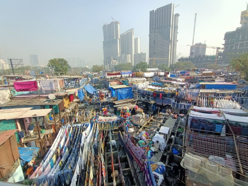 Mumbai: Dhobi Ghat Tour with Dharavi and Train Ride Options - Key highlights at a glance